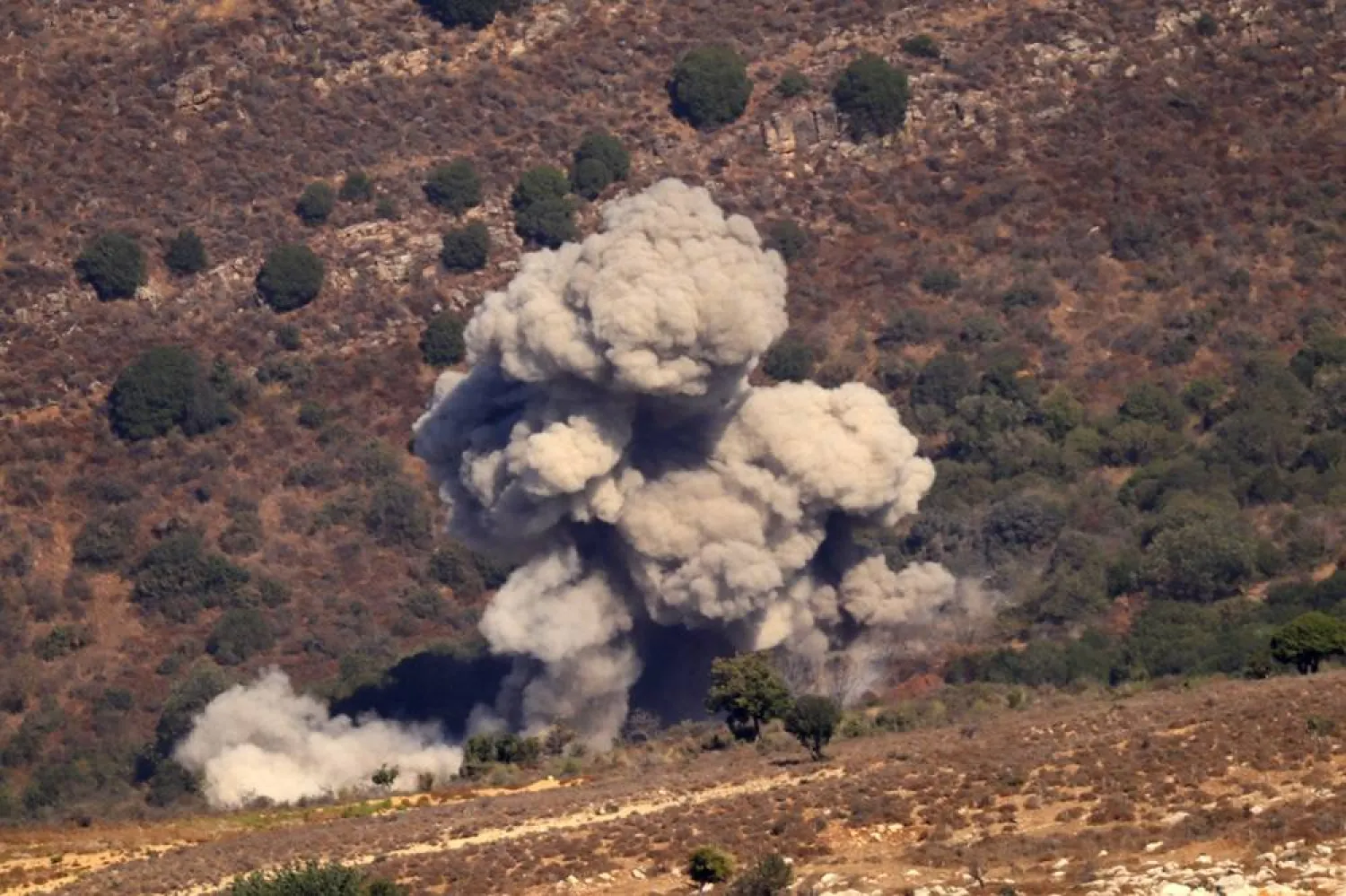 Smoke billows after an Israeli strike near the southern Lebanese village of Al-Mahmoudiye on September 24, 2024. (AFP)