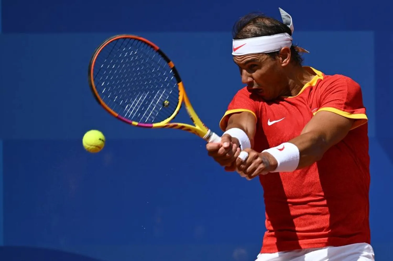 28 July 2024, France, Paris: Spain's Rafael Nadal in action during the Men's Singles First Round match against Hungary's Marton Fucsovics at Roland-Garros, on Day Two of the Paris 2024 Olympic Games. (dpa)