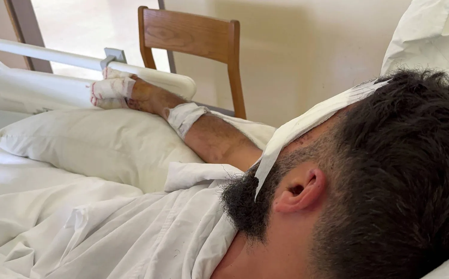 A man, who was wounded when pagers used by Hezbollah detonated on Tuesday across Lebanon, receives treatment at Sidon Governmental Hospital, in Sidon, Lebanon September 20, 2024. REUTERS/Ali Hankir