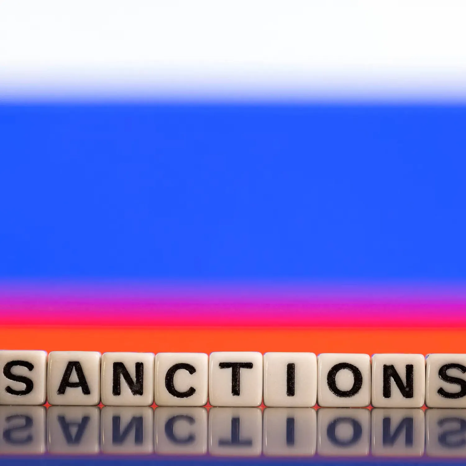 Plastic letters arranged to read "Sanctions" are placed in front of Russian flag colors in this illustration taken February 25, 2022. REUTERS/Dado Ruvic/Illustration/File Photo 