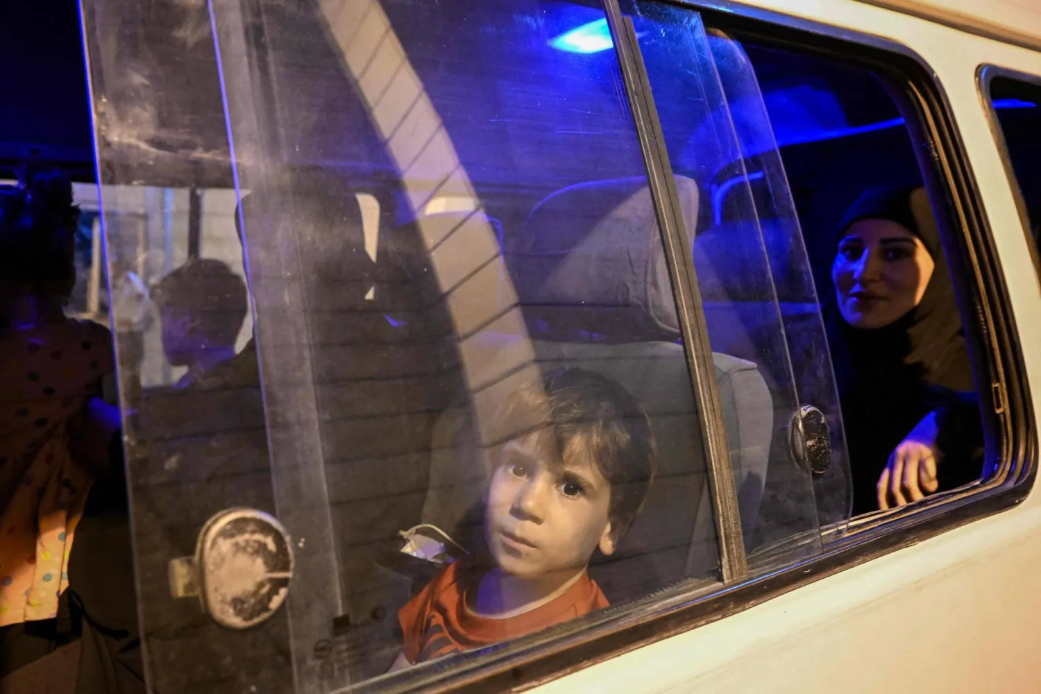 People fleeing from Lebanon arrive on the Syrian side of the border with Lebanon in Jdeidat Yabus in southwestern Syria on September 25, 2024. (Photo by LOUAI BESHARA / AFP)
