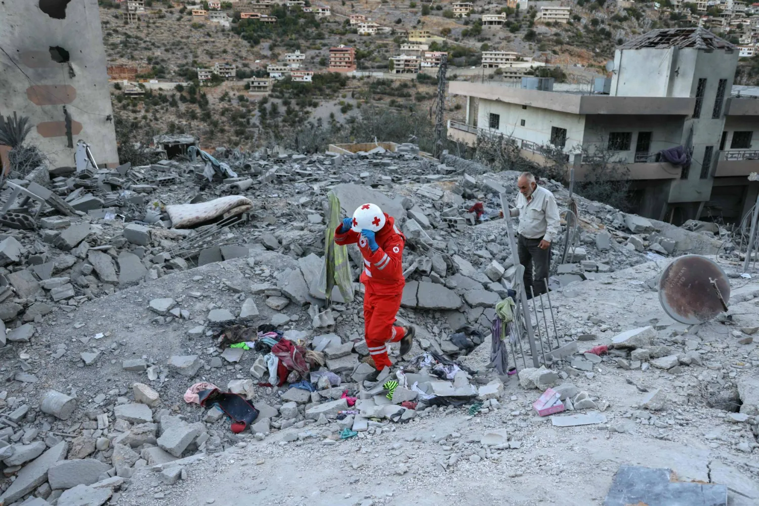 People check the destruction following an overnight Israeli airstrike in the southern Lebanese village of Shebaa near along the border between the two countries, on September 27, 2024. (Photo by Rabih DAHER / AFP)