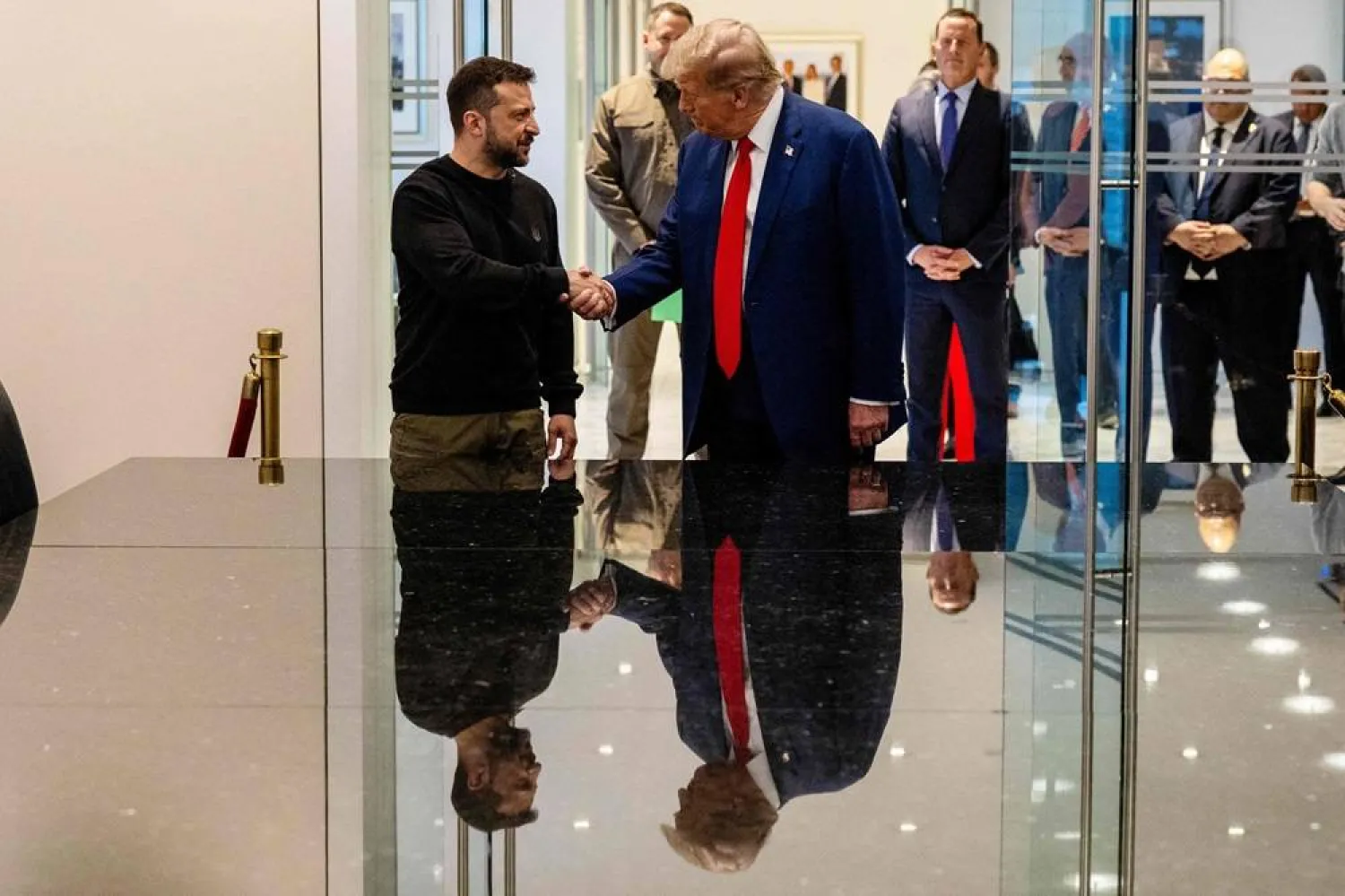 (L-R) Ukrainian President Volodymyr Zelenskyy and Republican presidential nominee, former US President Donald Trump, shake hands during a meeting on September 27, 2024 in New York City. (Getty Images/AFP) 