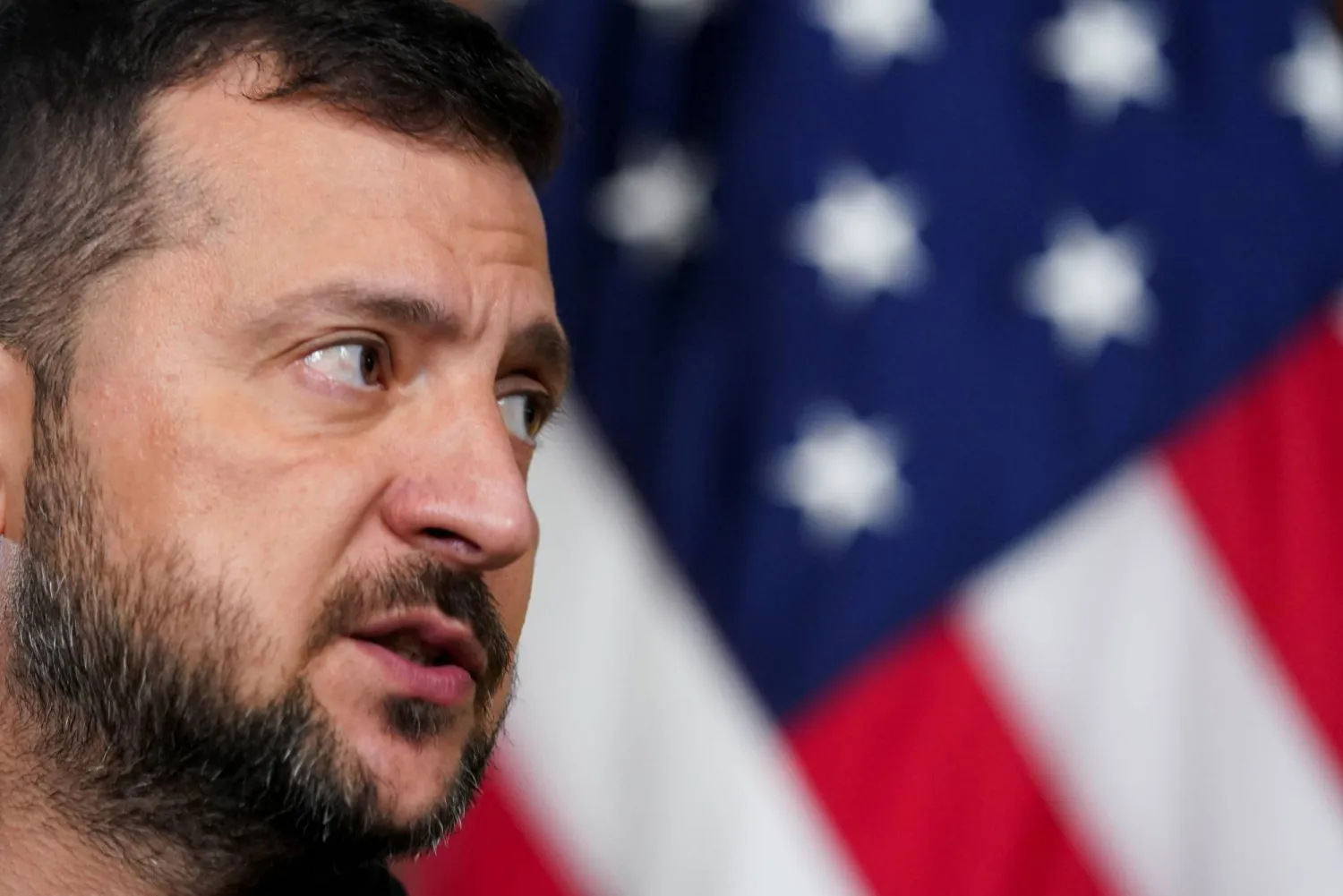 Ukraine's President Volodymyr Zelenskiy looks on as he meets with democratic presidential nominee and US Vice President Kamala Harris (not pictured), in the Vice President's Ceremonial Office in the Eisenhower Executive Office Building on the White House campus in Washington, US, September 26, 2024. REUTERS/Kevin Lamarque