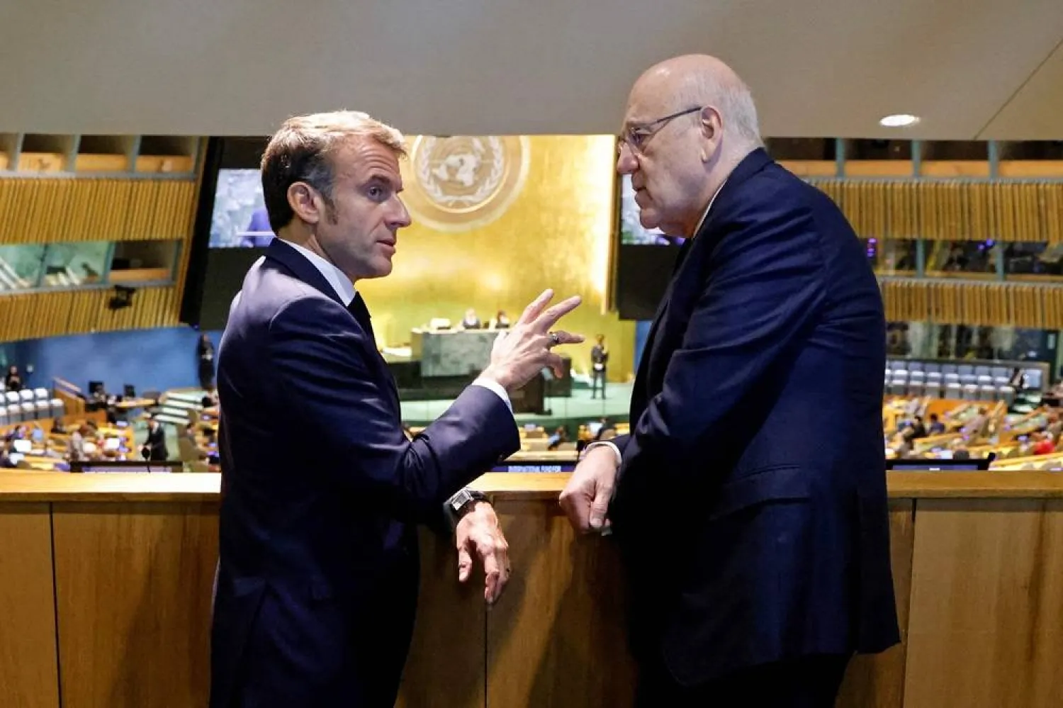 French President Emmanuel Macron (L) speaks with caretaker Prime Minister of Lebanon Najib Mikati on the sidelines of the 79th Session of the United Nations General Assembly in New York on September 25, 2024. (AFP)