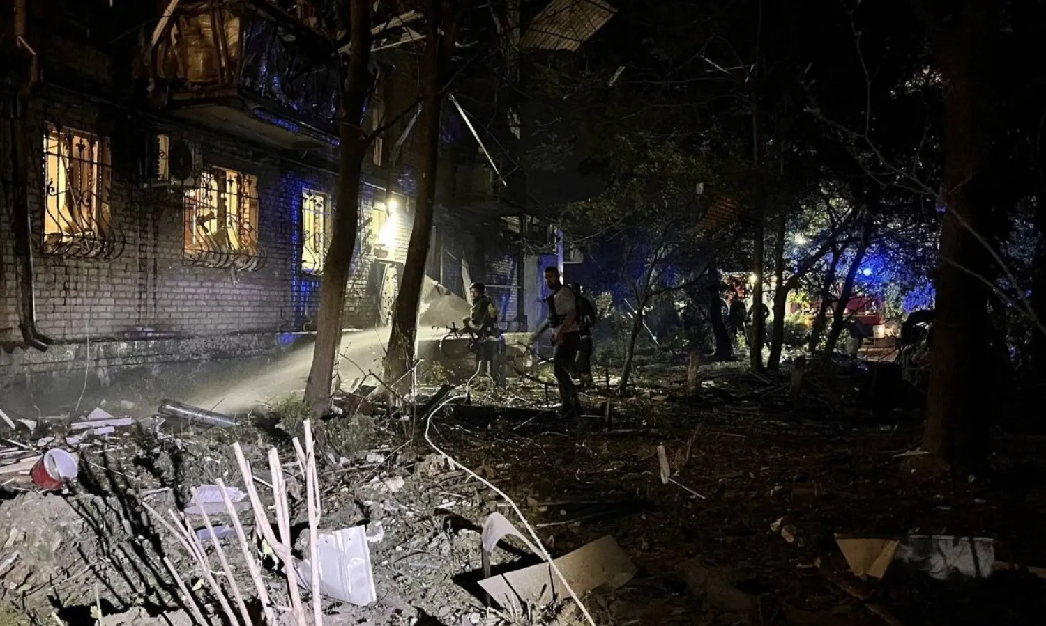 Firefighters and rescuers work at a site of an apartment building damaged by a Russian air strike, amid Russia's attack on Ukraine, in Zaporizhzhia, Ukraine, in this handout picture released on September 23, 2024. Press service of the State Emergency Service of Ukraine in Zaporizhzhia region/Handout via REUTERS    
