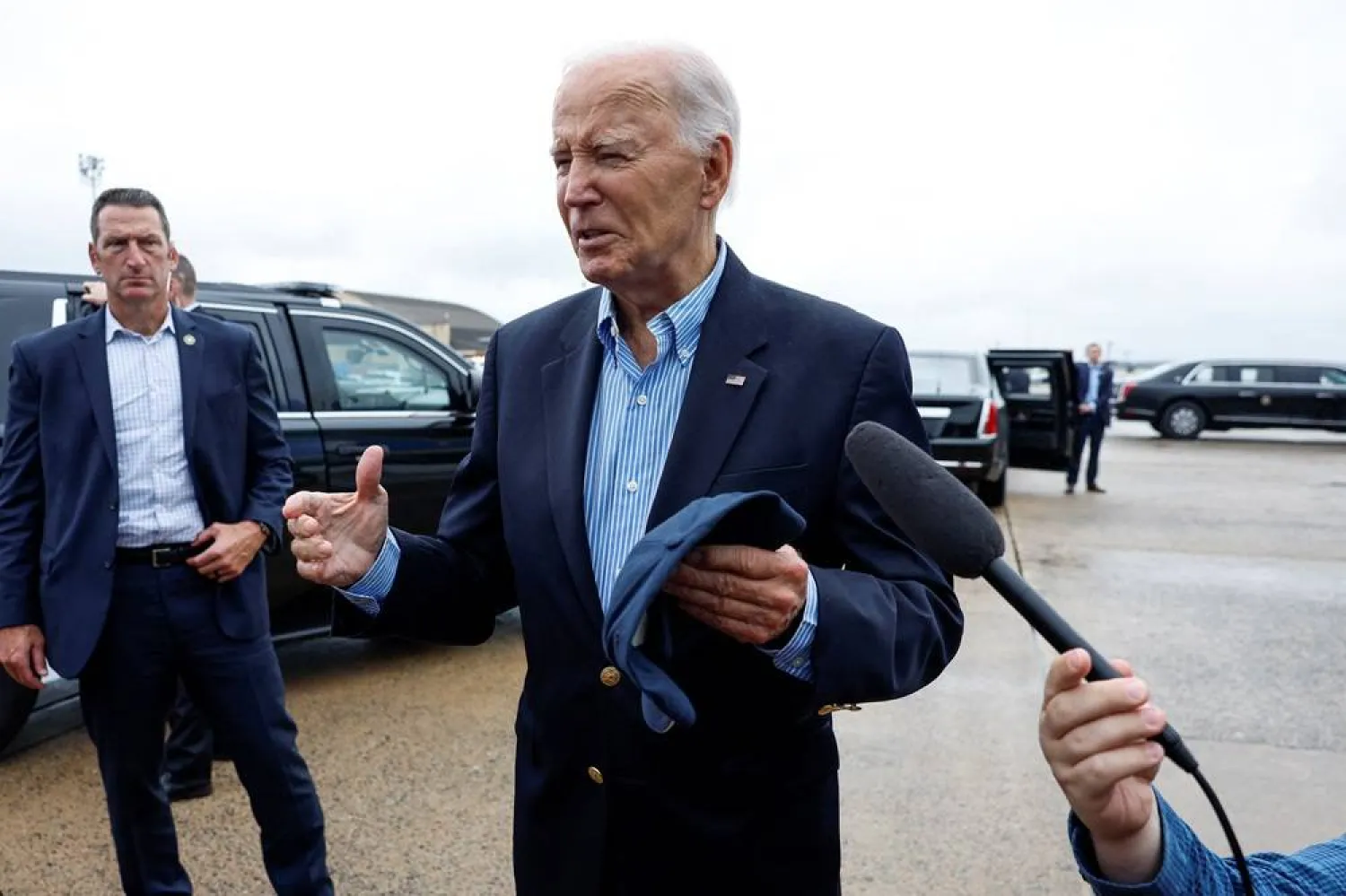 US President Joe Biden speaks to members of the media before boarding Air Force One en route to North and South Carolina, in the wake of Hurricane Helene, at Joint Base Andrews, Maryland, US, October 2, 2024. (Reuters)