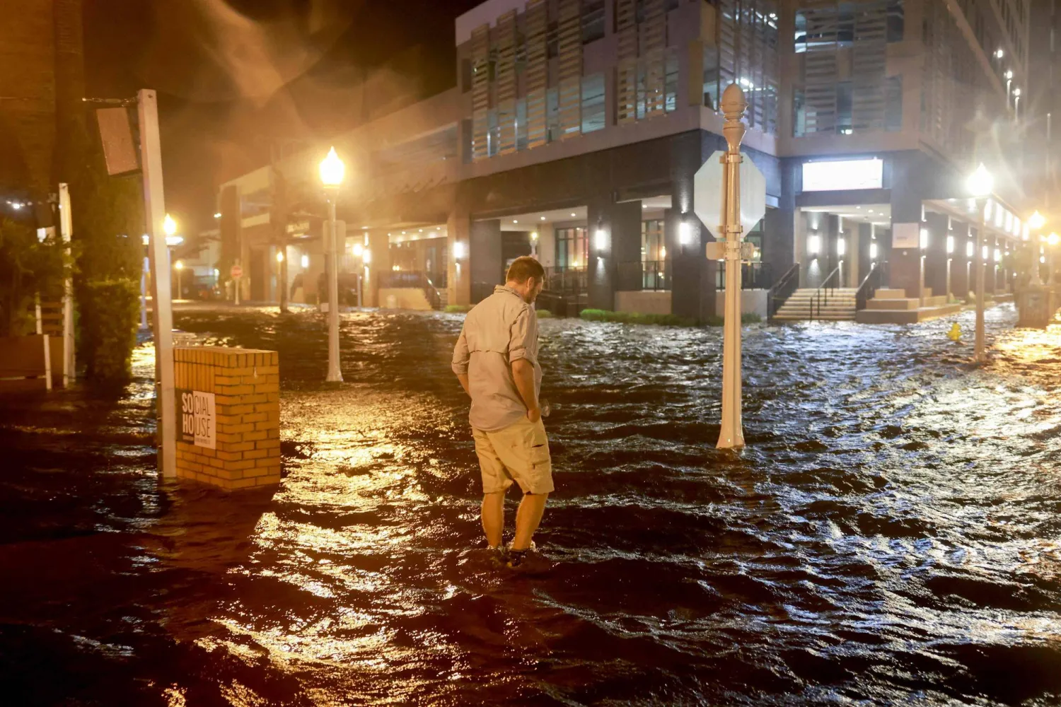 Brandon Marlow walks through surge waters flooding the street after Hurricane Milton came ashore in the Sarasota area on October 09, 2024, in Fort Myers, Florida. Joe Raedle/Getty Images/AFP 