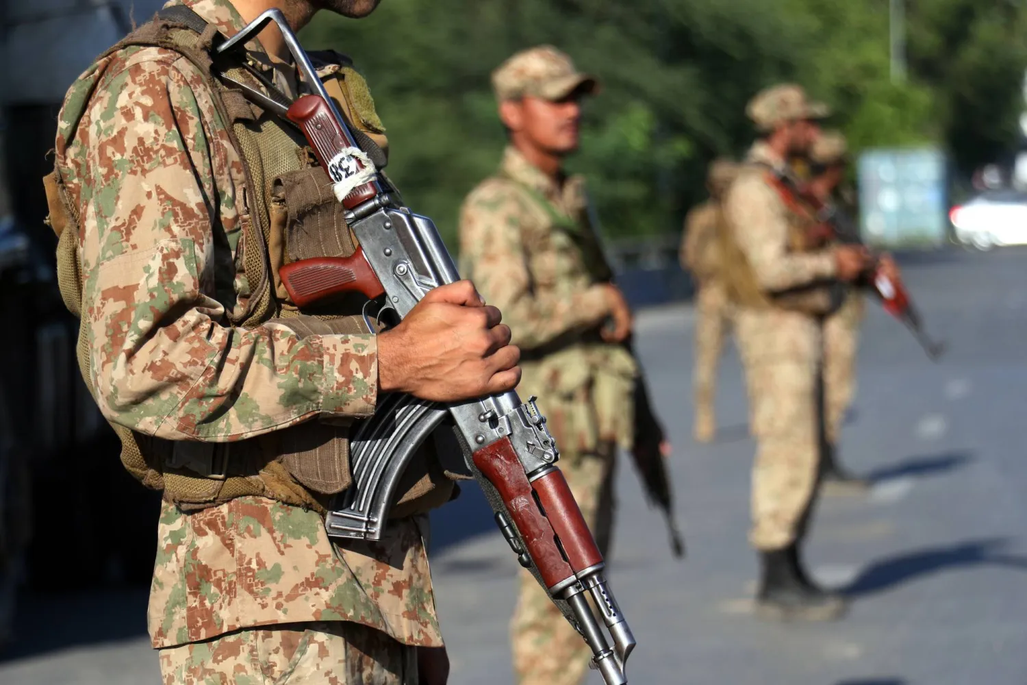 Pakistani Army and security officials stand guard as the opposition party Pakistan Tehrik-e-Insaft (PTI) continue their protest for the third day demanding release of former Prime Minister Imran Khan, in Islamabad, Pakistan, 06 October 2024. EPA/SOHAIL SHAHZAD