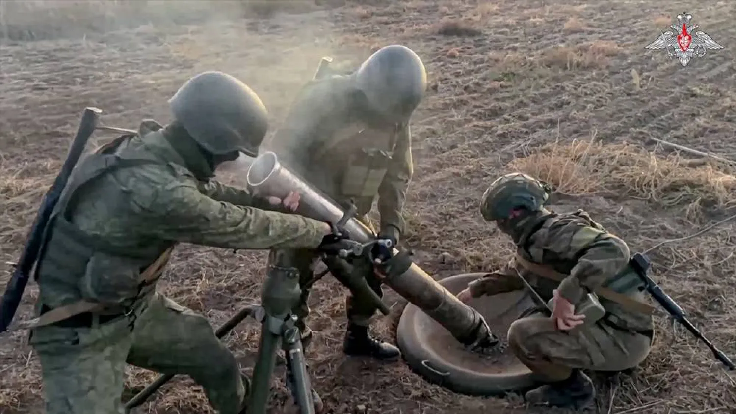  In this image taken from video distributed by Russian Defense Ministry Press Service on Tuesday, Oct. 15, 2024, Russian 120mm mortar crew change a position after firing toward Ukrainian position at an undisclosed location in Ukraine. (Russian Defense Ministry Press Service via AP) 