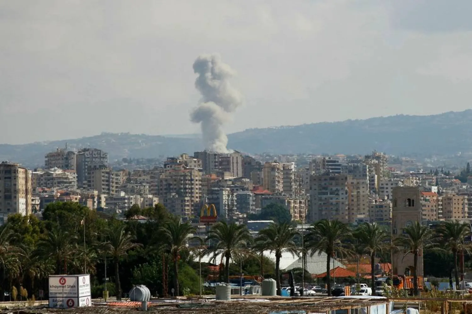  A picture taken from the southern Lebanese city of Tyre shows smoke rising from the site of an Israeli strike targeting the village of Qana on October 12, 2024. (AFP) 