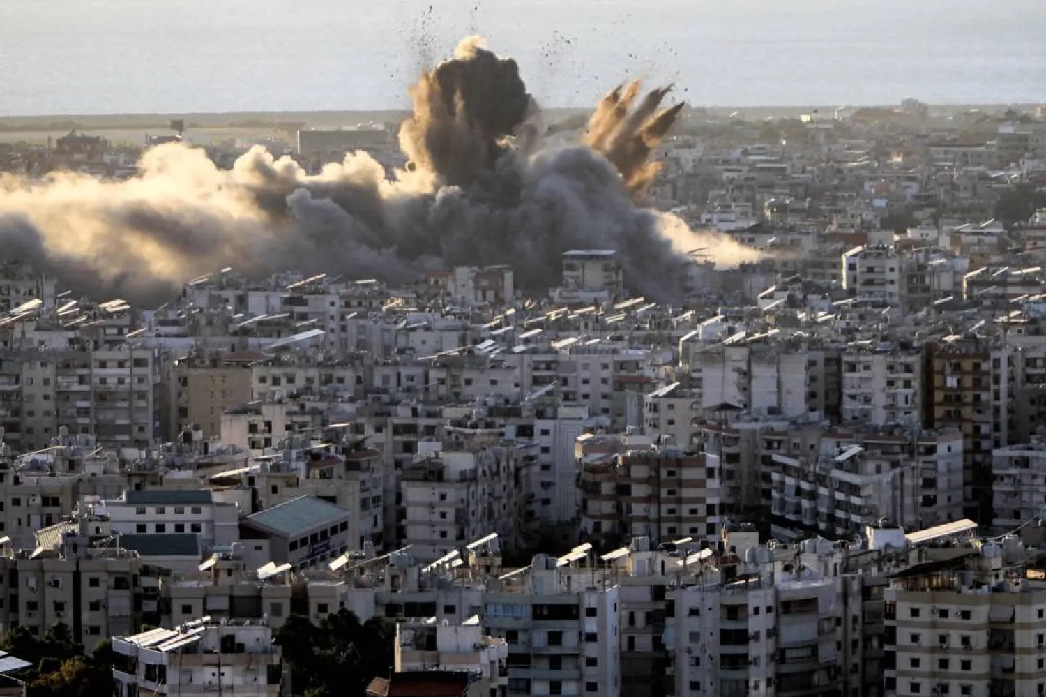 A cloud of smoke erupts following an Israeli airstrike on Beirut's southern suburbs on October 19, 2024. (AFP) 