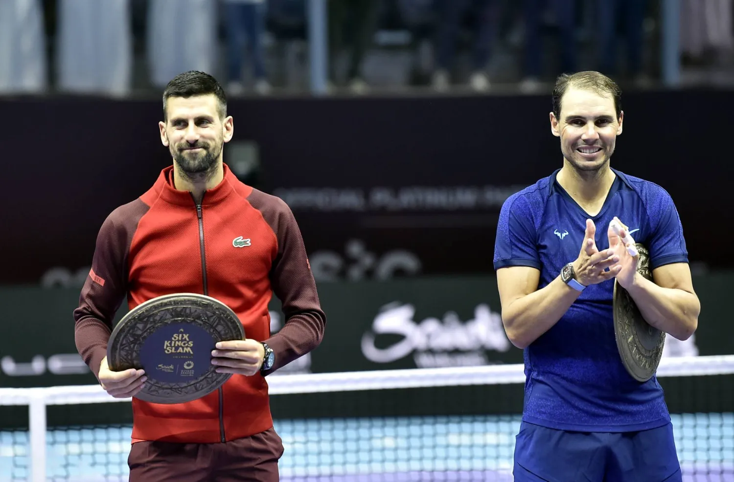 Novak Djokovic of Serbia (L) and Rafel Nadal of Spain hold their trophies after their third place match at the Six Kings Slam exhibition tennis tournament in Riyadh, Saudi Arabia, 19 October 2024. EPA/STR
