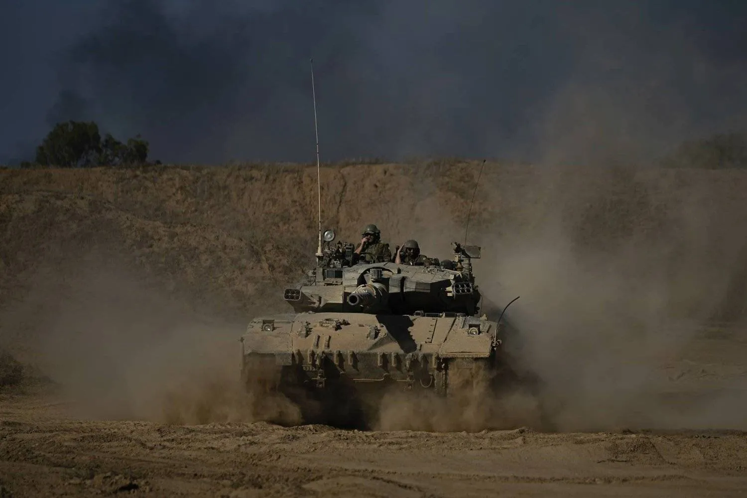 An Israeli army tank maneuvers near the Israel-Gaza border in southern Israel, Sunday, Oct. 20, 2024. (AP Photo/Tsafrir Abayov)
