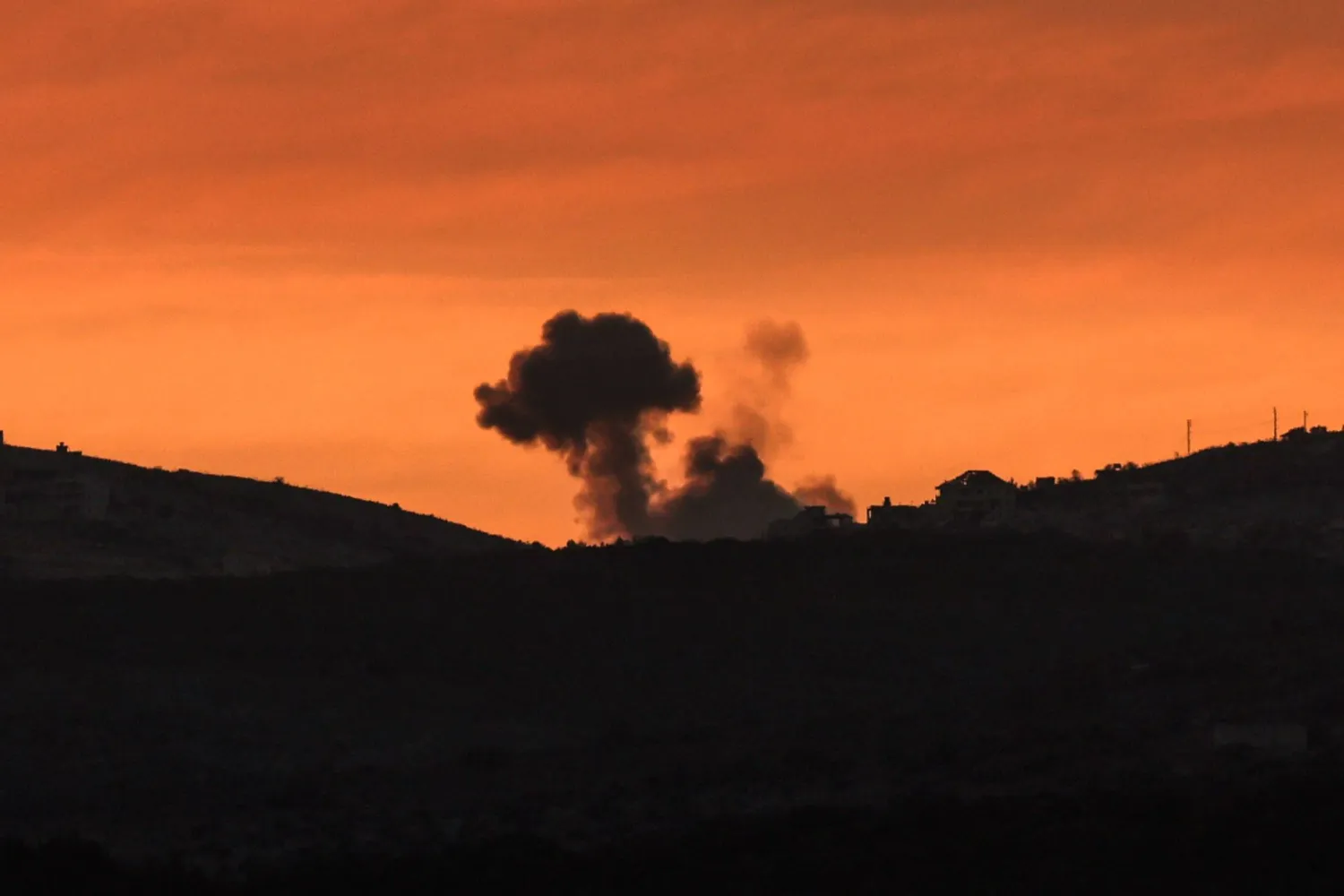 Smoke rises as a result of explosions in the southern Lebanese village of Blida, as seen from northern Israel, 20 October 2024. EPA/ATEF SAFADI
