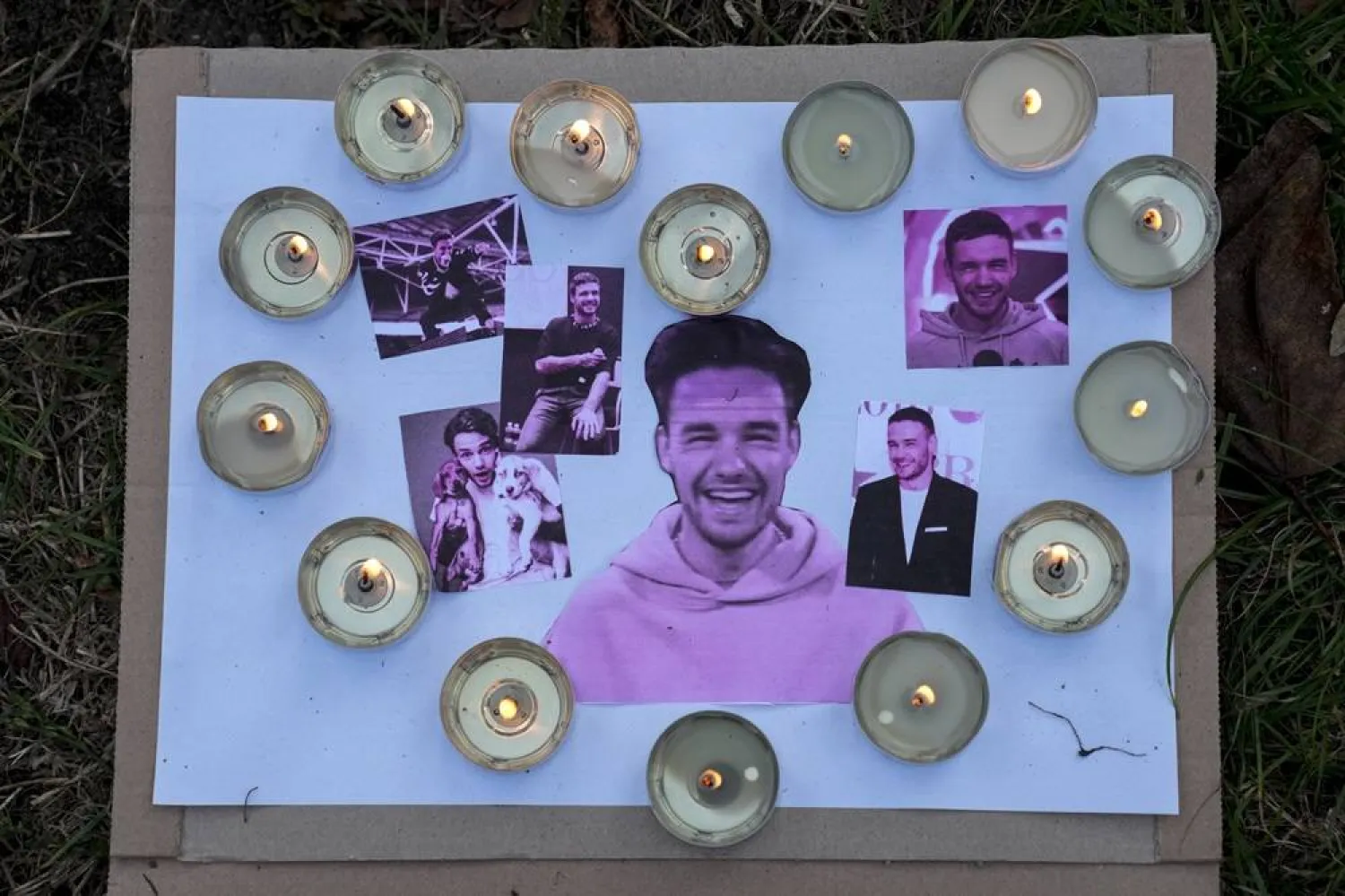  Pictures and candles are placed as fans gather to pay tribute to late British singer Liam Payne, former member of the British pop band One Direction, in Treptower Park in Berlin, Germany, Sunday, Oct. 20, 2024. (AP)