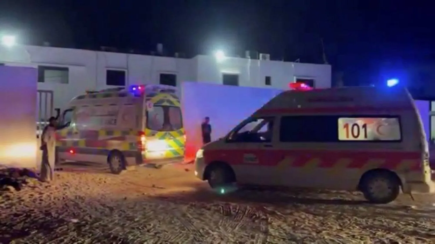 Ambulances pass through an entrance, during the evacuation of people from Kamal Adwan Hospital in northern Gaza to Al-Shifa Hospital in Gaza City, at Al-Shifa Hospital in Gaza City, in this screen grab taken from a handout video released on October 12, 2024. (Palestine Red Crescent Society/Handout via Reuters)