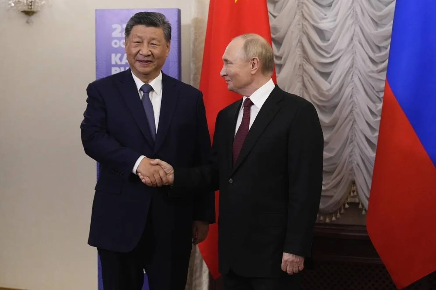  Russian President Vladimir Putin, right, and Chinese President Xi Jinping shake hands during their meeting on the sidelines of BRICS Summit at Kazan Kremlin in Kazan, Russia, Tuesday, Oct. 22, 2024. (AP Photo/Alexander Zemlianichenko, Pool) 