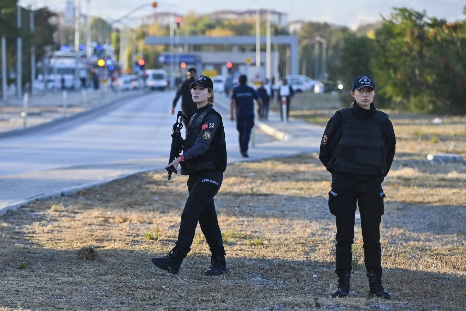 Emergency and security teams are deployed outside of Turkish Aerospace Industries Inc. at the outskirts of Ankara, Türkiye, Wednesday, Oct. 23, 2024. (AP Photo)