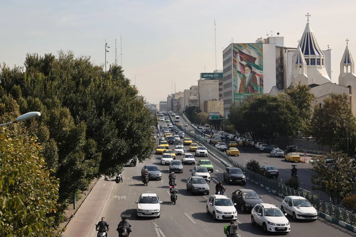 Cars pass on a street after several explosions were heard, in Tehran, Iran, October 26, 2024. Majid Asgaripour/WANA (West Asia News Agency) via REUTERS 