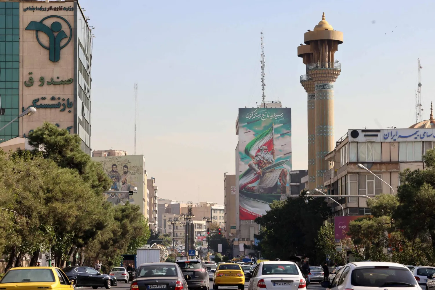 Commuters drive along a street in Tehran on October 26, 2024. (Photo by ATTA KENARE / AFP)
