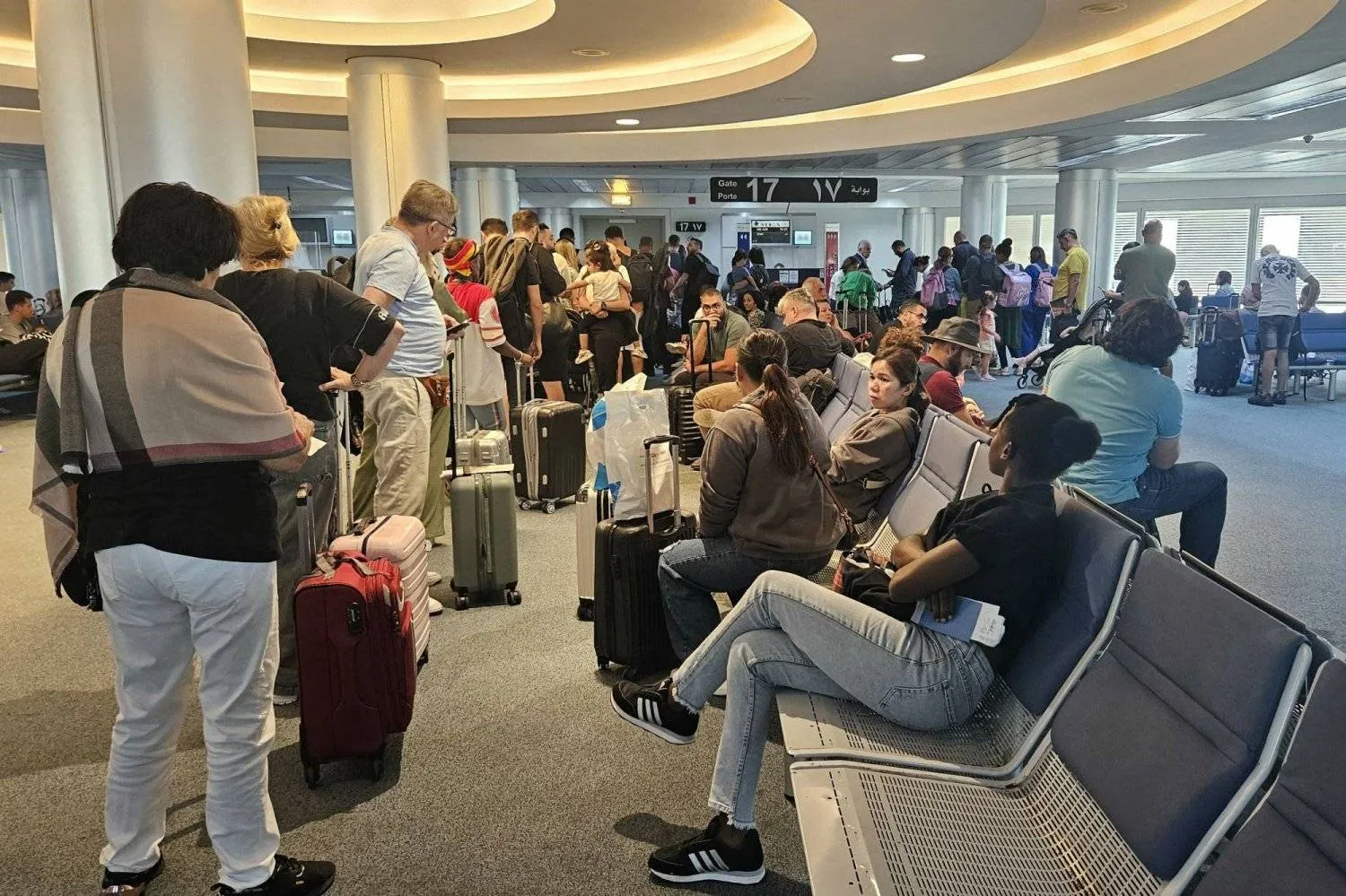 Travelers waiting to board their plane at the Beirut International Airport (AFP)