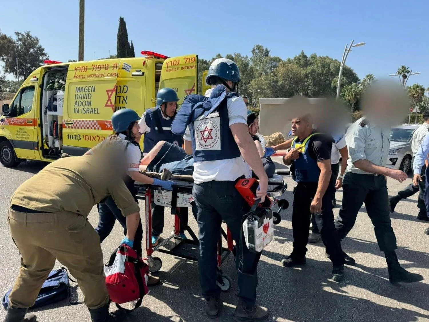 One of the injured people is evacuated after a truck crashed into a bus stop in Glilot, north of Tel Aviv (Israel Ambulance Service)