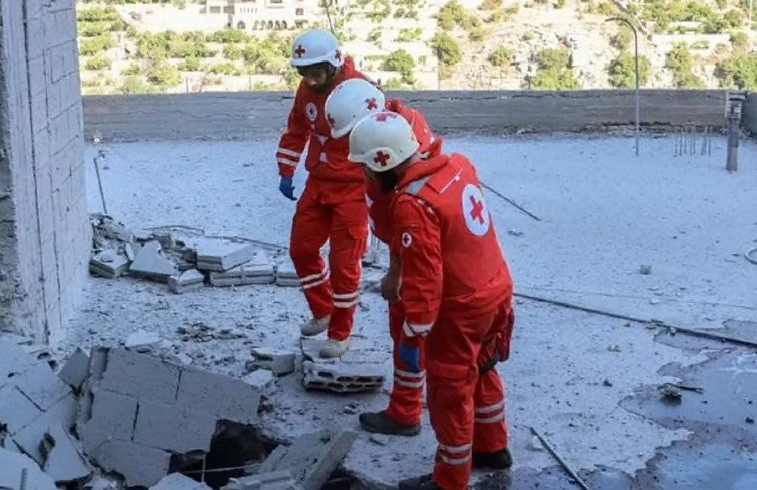 Members of the Lebanese Red Cross inspect damage after an Israeli bombardment -  AFP