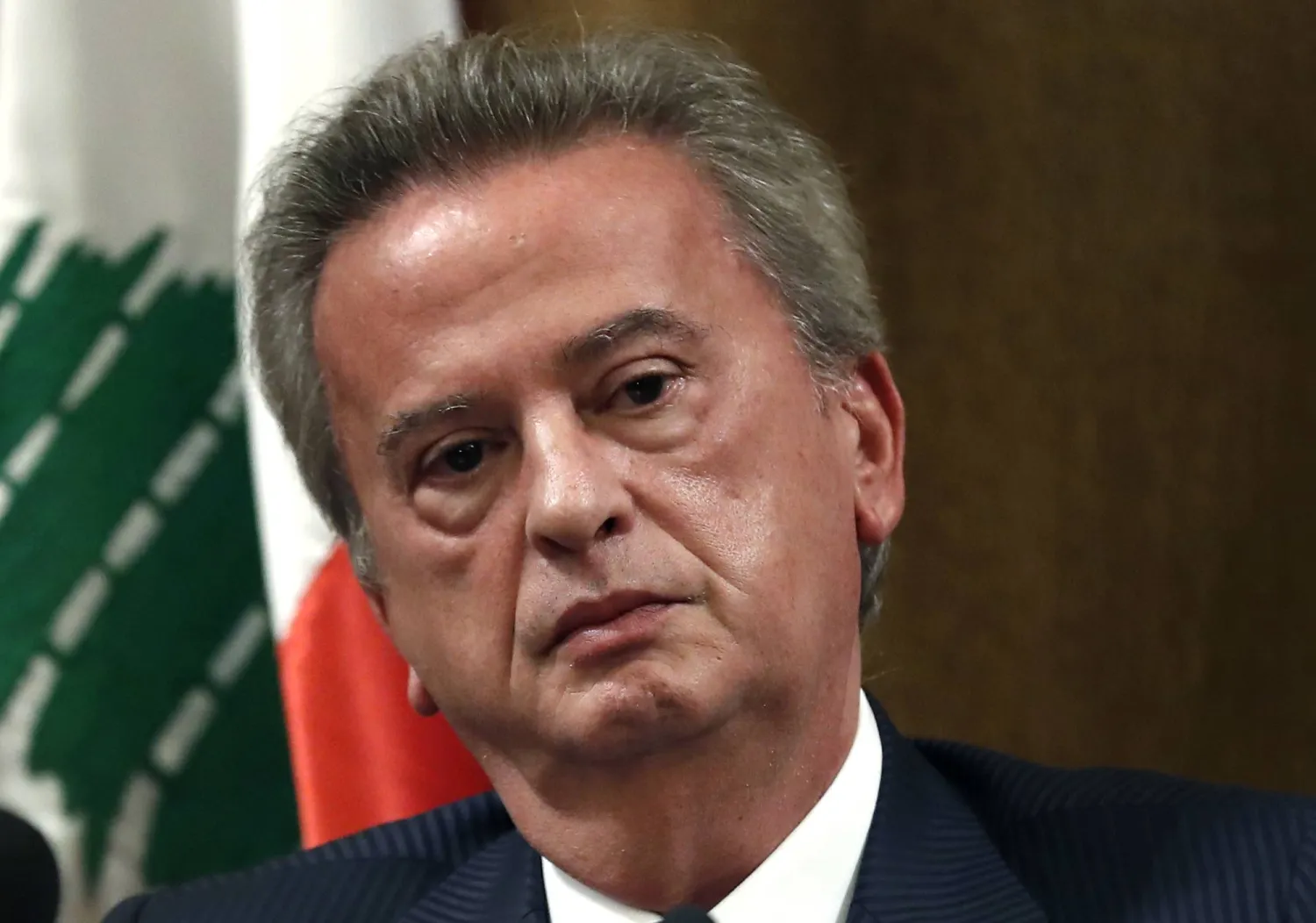 FILE - Riad Salameh, the governor of Lebanon's Central Bank, listens to a journalist's question during a press conference, in Beirut, Lebanon, Nov. 11, 2019. (AP Photo/Hussein Malla, File)