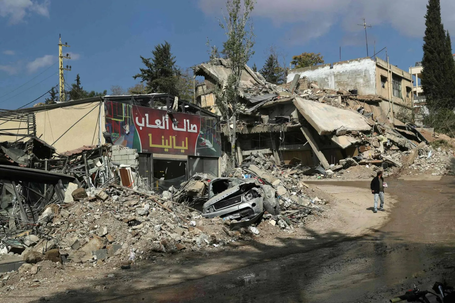 A man walks near destroyed buildings in the aftermath of an overnight Israeli airstrike that targeted Baalbek's al-Charawneh neighborhod in Lebanon's eastern Bekaa valley on November 2, 2024. (Photo by AFP)