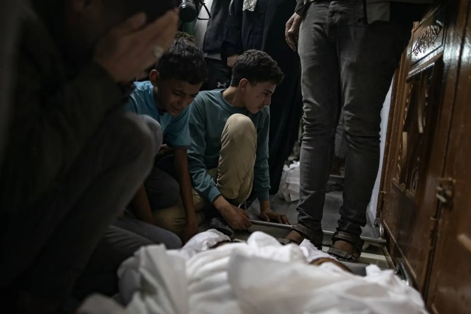 Family members mourn next to the bodies of their loved ones at Nasser Hospital following an Israeli airstrike that claimed the lives of at least eight people in Khan Younis, southern Gaza Strip, 03 November 2024. (EPA)