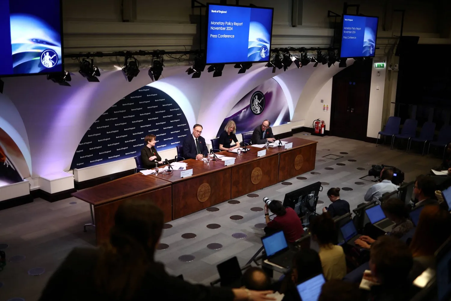 Bank of England Deputy Governor for Monetary Policy Clare Lombardelli, Bank of England Governor Andrew Bailey, The Bank of England's Head of Media and Stakeholder Engagement Katie Martin and Deputy Governor, Markets and Banking, Dave Ramsden hold the central bank's Monetary Policy Report press conference at the Bank of England, in London, on November 7, 2024. HENRY NICHOLLS/Pool via REUTERS