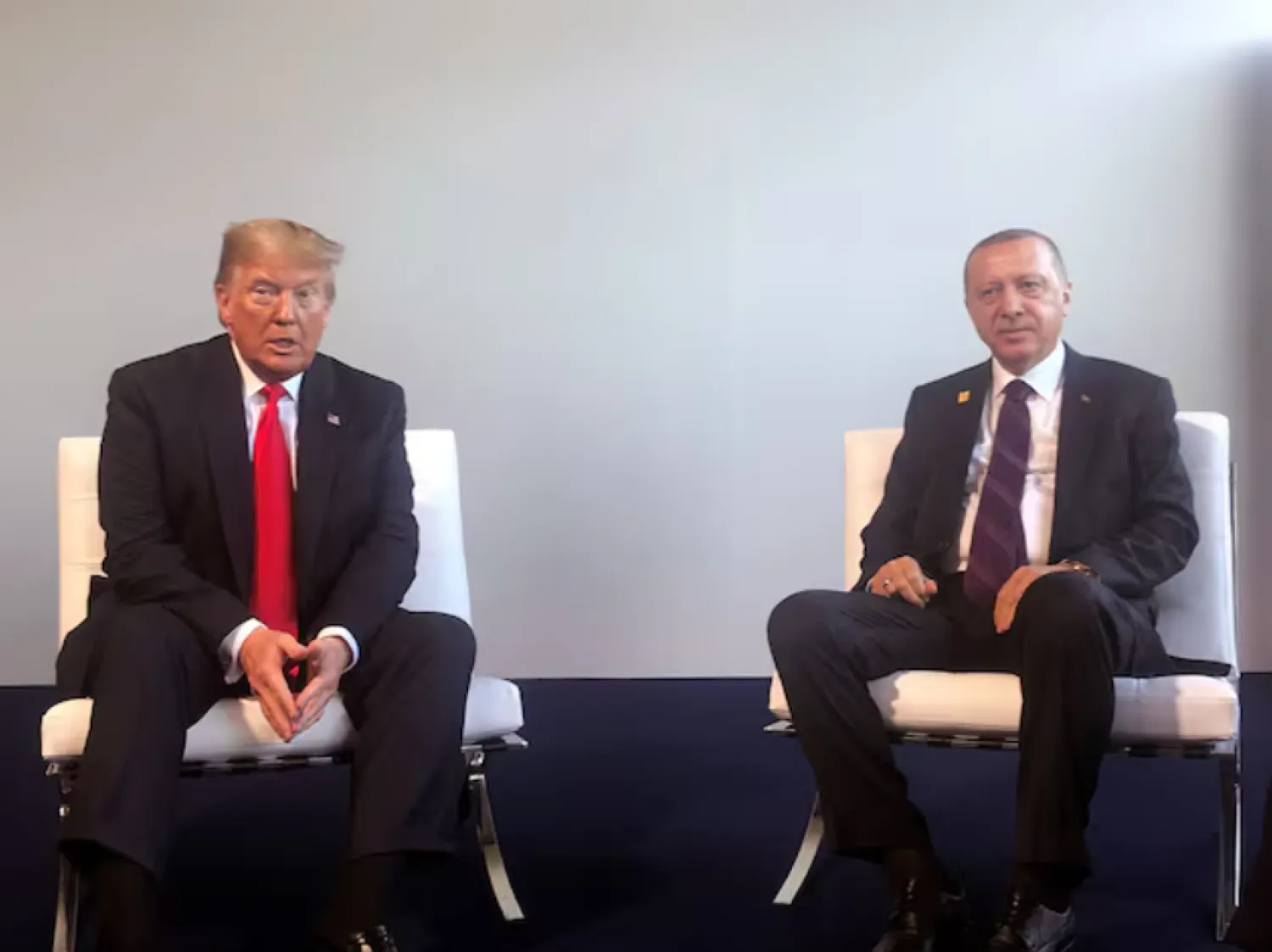 Turkish President Tayyip Erdogan meets with US President Donald Trump during the NATO summit in London, Britain, December 4, 2019. Murat Cetinmuhurdar/Presidential Press Office/Handout via REUTERS/File Photo