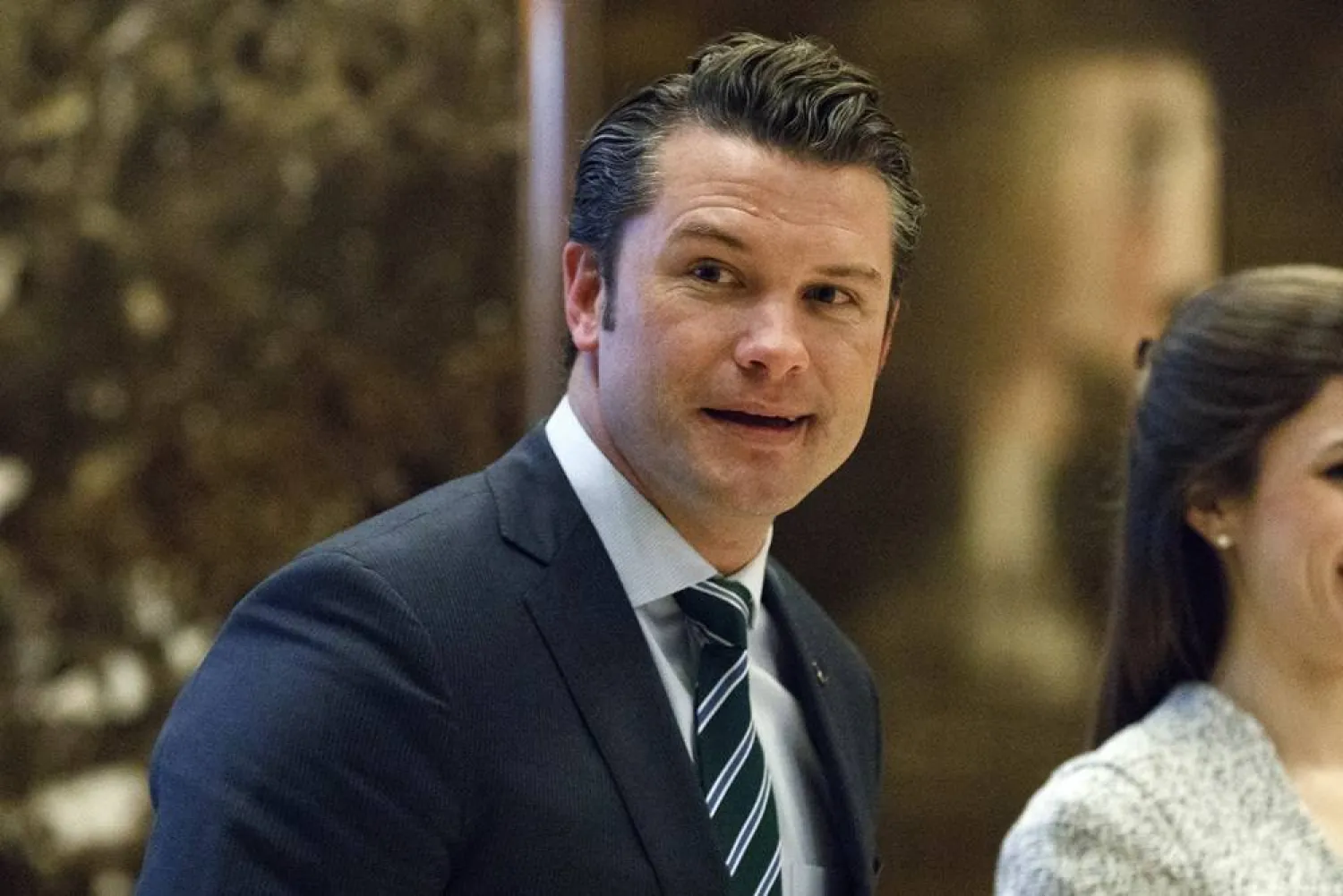 Pete Hegseth walks to an elevator for a meeting with President-elect Donald Trump at Trump Tower in New York, Dec. 15, 2016. (AP)