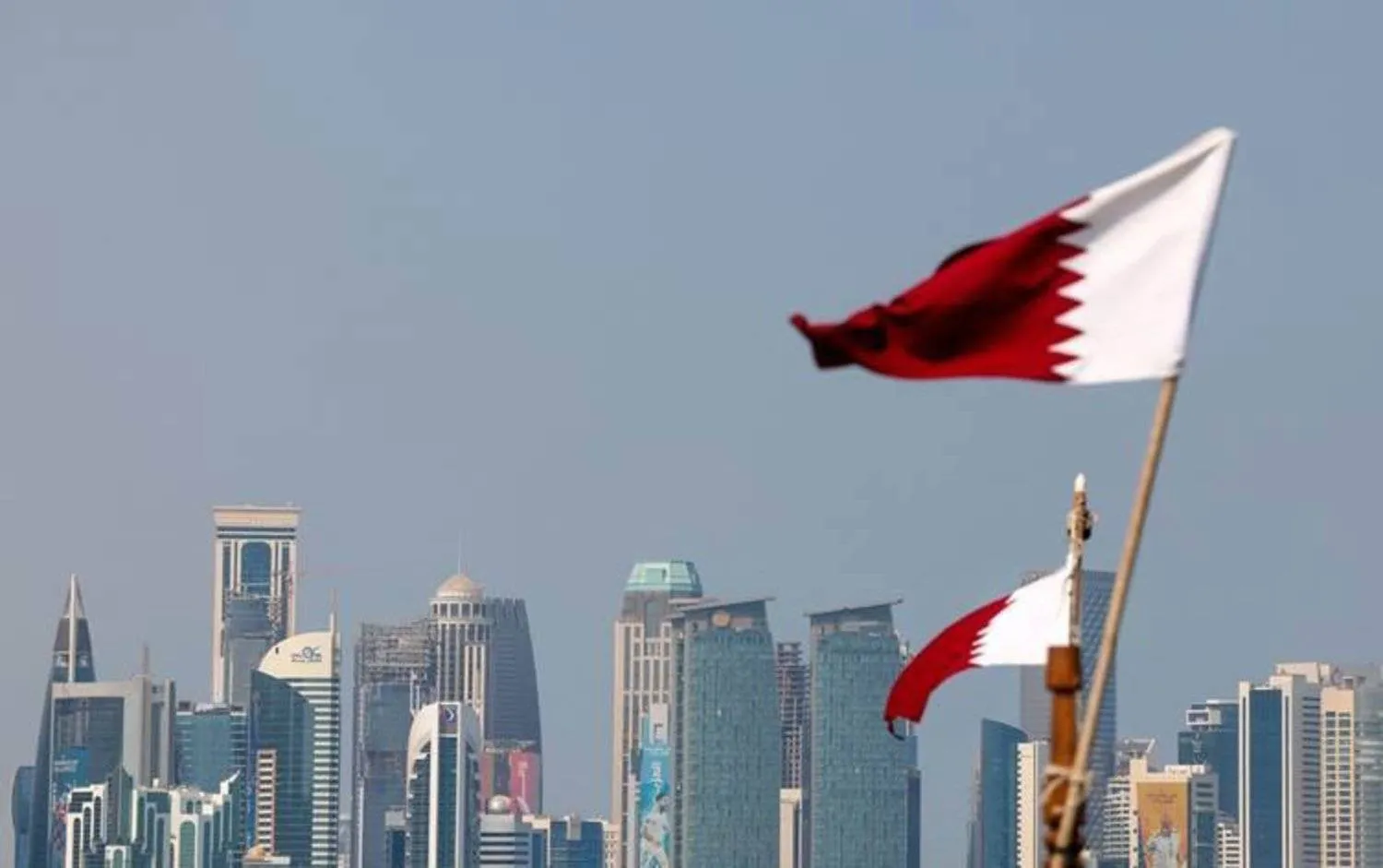 Qatari flag flutters in Doha - AAWSAT/File

