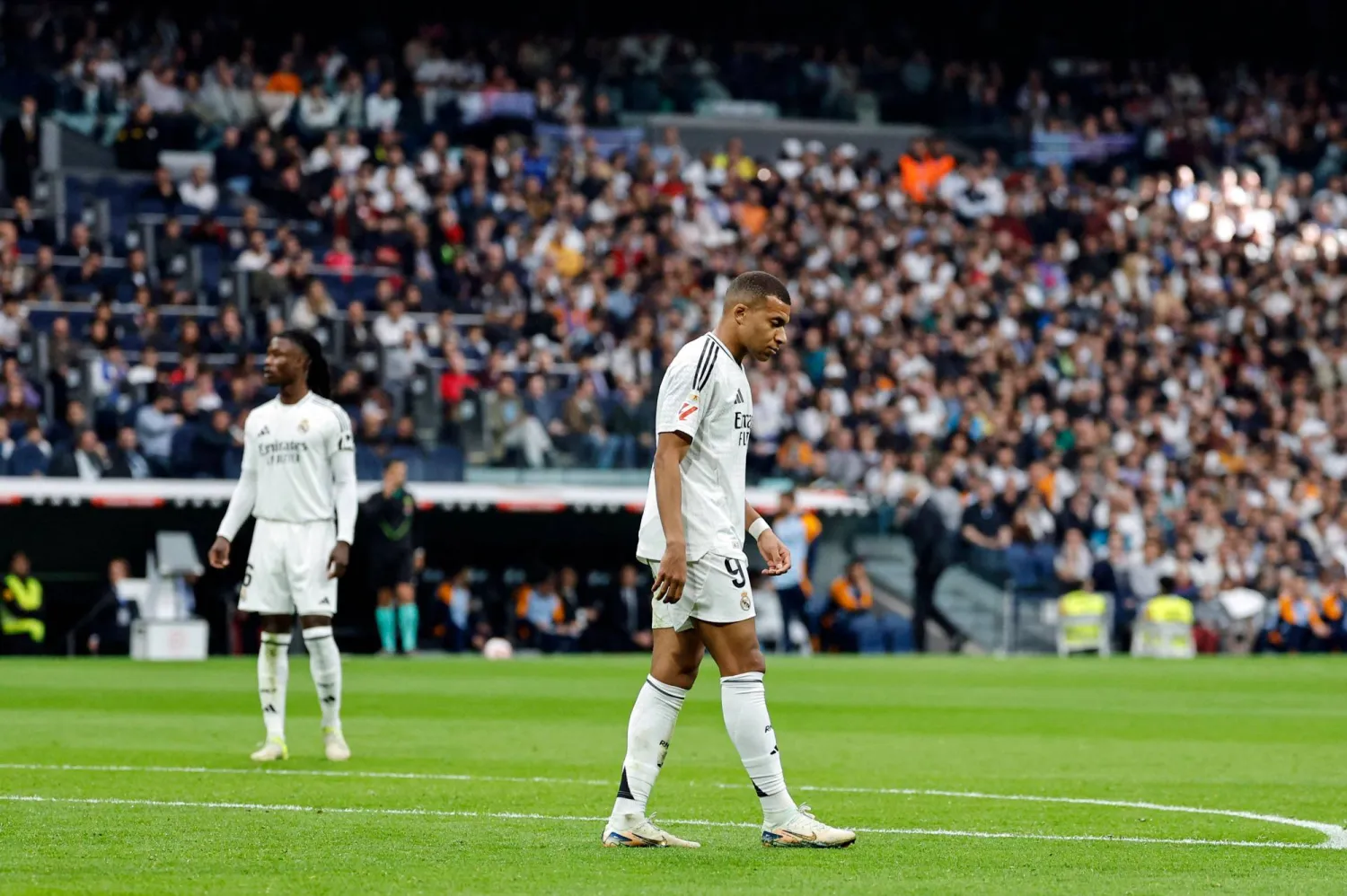 Real Madrid's French forward #09 Kylian Mbappe looks on during the Spanish league football match between Real Madrid CF and CA Osasuna at the Santiago Bernabeu stadium in Madrid on November 09, 2024. (Photo by OSCAR DEL POZO / AFP)