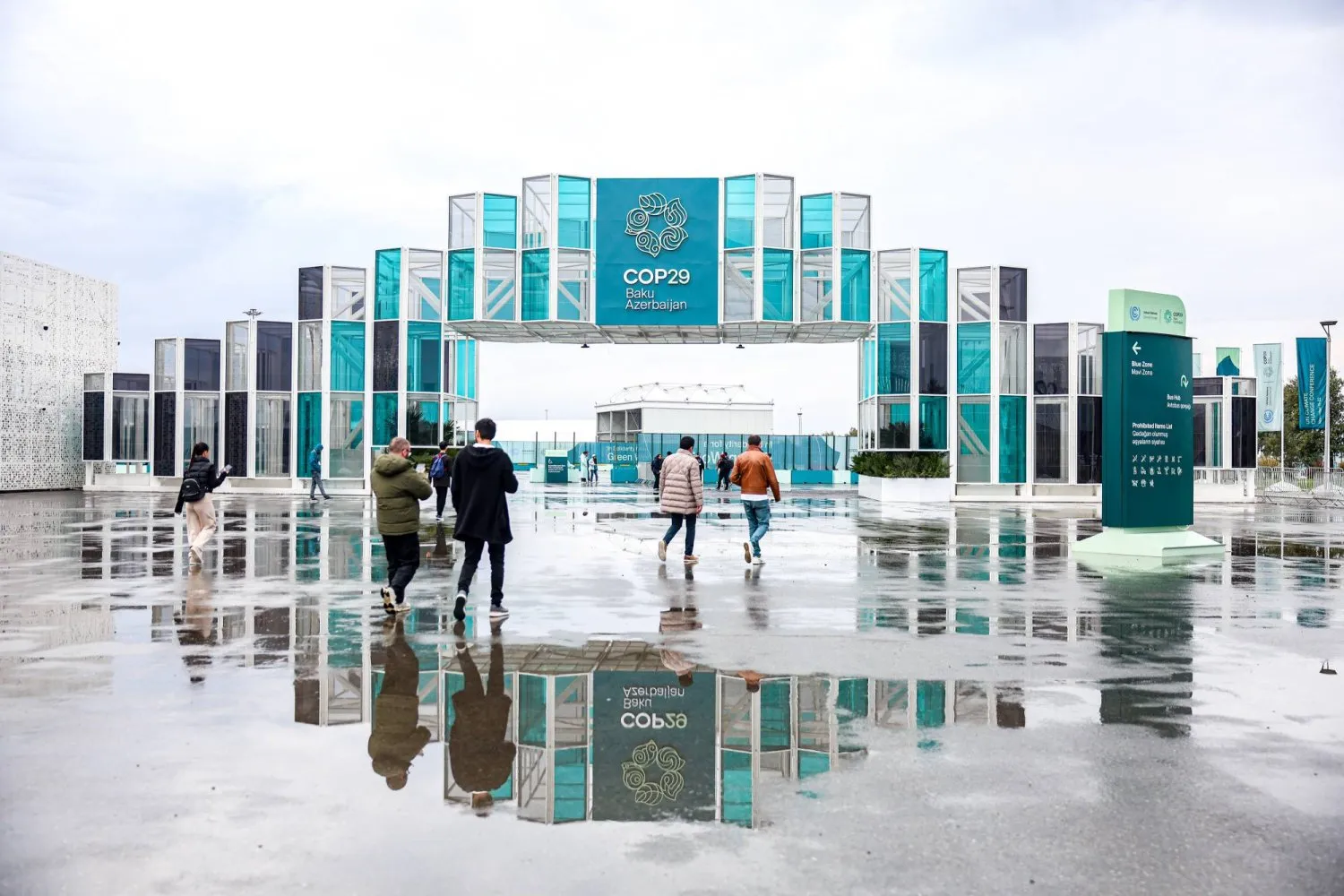 Visitors heading to the entrance of the conference hall hosting the United Nations Climate Change Conference (COP29) in Baku (dpa)