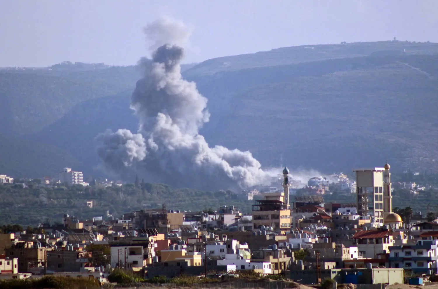 A photo taken from the southern Lebanese city of Tyre shows smoke rising from the site of an Israeli airstrike that targeted the village of Qlayleh on November 17, 2024, amid the ongoing war between Israel and Hezbollah. (Photo by Kawnat HAJU / AFP)