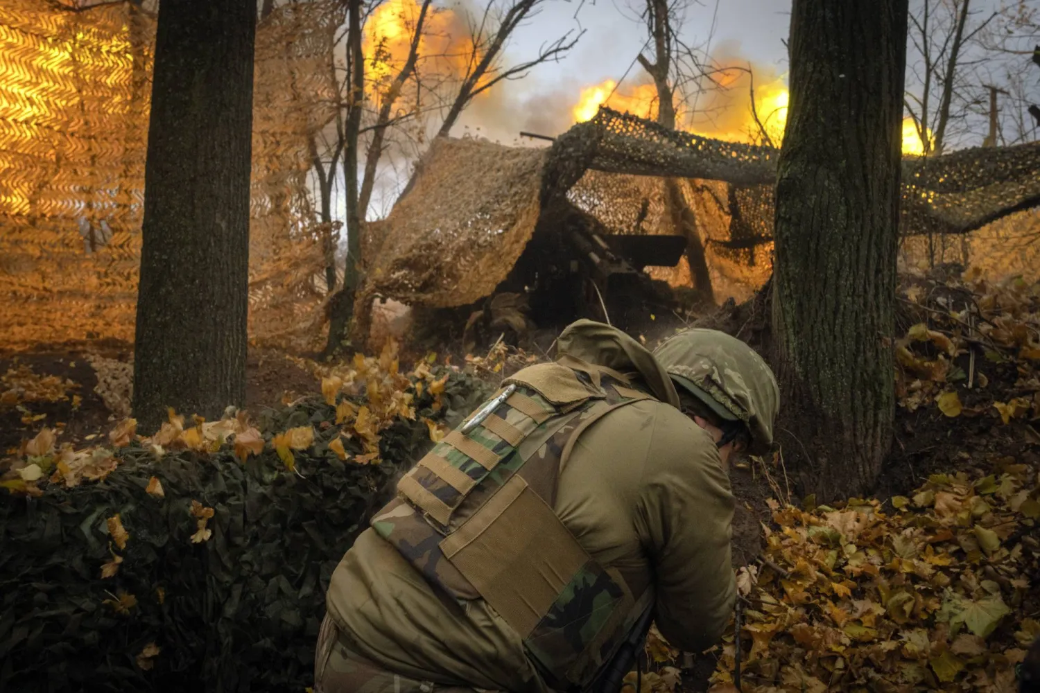 A serviceman of the 13th Brigade of the National Guard of Ukraine fires a Giatsint-B gun towards Russian positions near Kharkiv, Ukraine, Wednesday, Nov. 6, 2024. (AP Photo/Efrem Lukatsky)