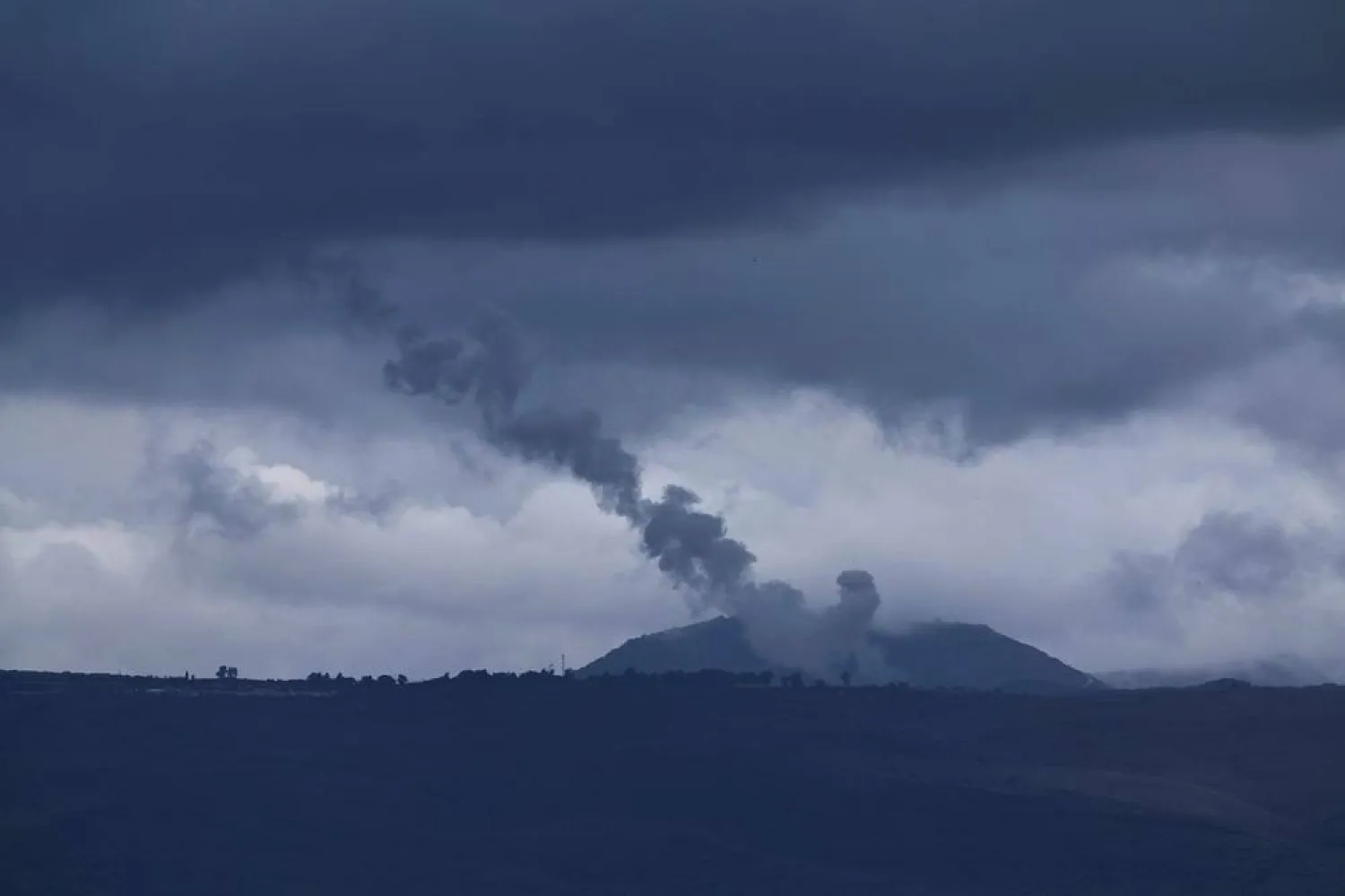 Trails of Israeli missiles launched towards targets in southern Lebanon, as seen from an undisclosed location in northern Israel, 18 November 2024, amid cross-border hostilities between Hezbollah and Israel. (EPA)