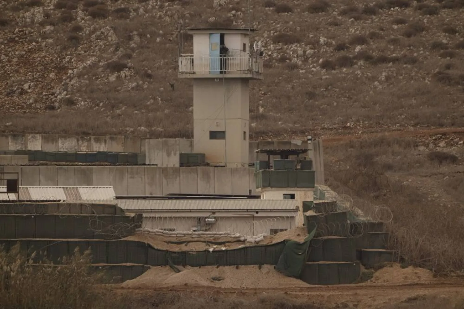  An UN soldier stands on the top of a tower at a base of the United Nations peacekeeping forces in Lebanon (UNIFIL) at the Israeli-Lebanese border as seen from northern Israel, Tuesday, Nov. 19, 2024. (AP)