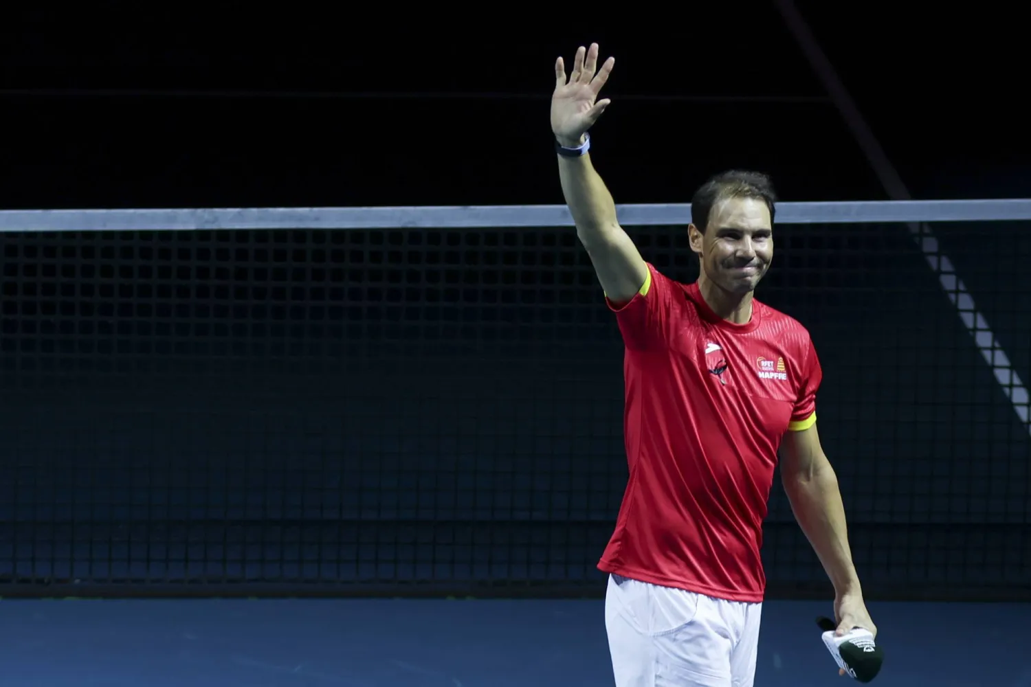 Rafa Nadal of Spain waves during a tribute received after the Spanish doubles match against the Netherlands during the Davis Cup quarterfinal between Netherlands and Spain at the Jose Maria Martin Carpena Sports Palace in Malaga, Spain, 19 November 2024.  EPA/JORGE ZAPATA