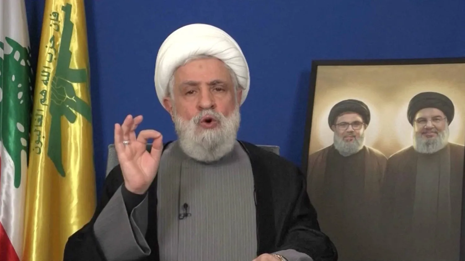 Hizbullah Genel Sekreteri Şeyh Naim Kasım, bir video klipten alınan bu fotoğrafta 20 Kasım 2024 tarihinde belirtilmemiş bir yerden bir konuşma yapıyor (Reuters)