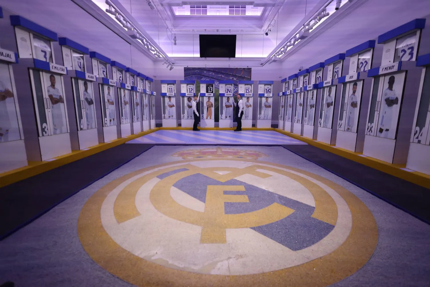 Members of Sotheby's staff pose with changing room lockers previously used by Real Madrid players in London, Britain, 20 November 2024. EPA/NEIL HALL