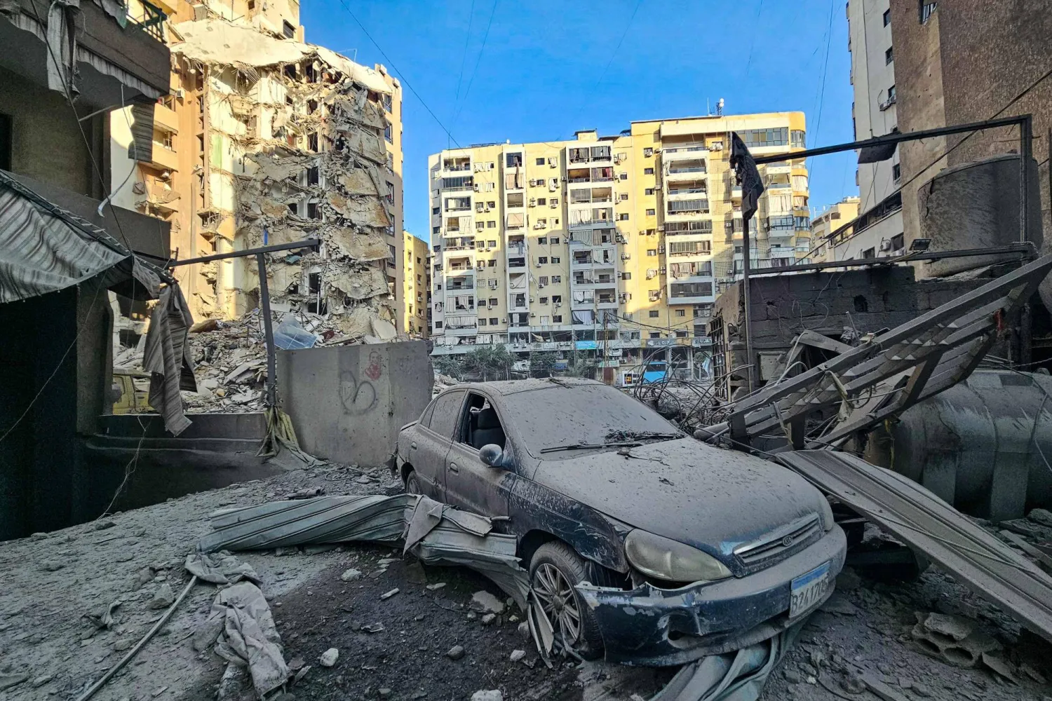A damaged car lies amid the destruction in the aftermath of an Israeli airstrike that targeted the neighborhood of Haret Hreik in Beirut's southern suburbs on November 23, 2024, amid the ongoing war between Israel and Hezbollah.  (Photo by AFP)