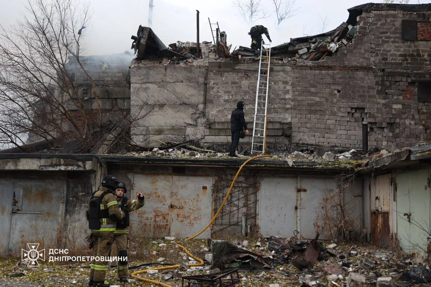 This handout photograph taken and released by the Ukrainian Emergency Service on November 21, 2024 shows Ukrainian firefighters work on a spot following an air-attack, in Dnipro, amid the Russian invasion of Ukraine. (Photo by Handout / State Emergency Service of Ukraine / AFP) 