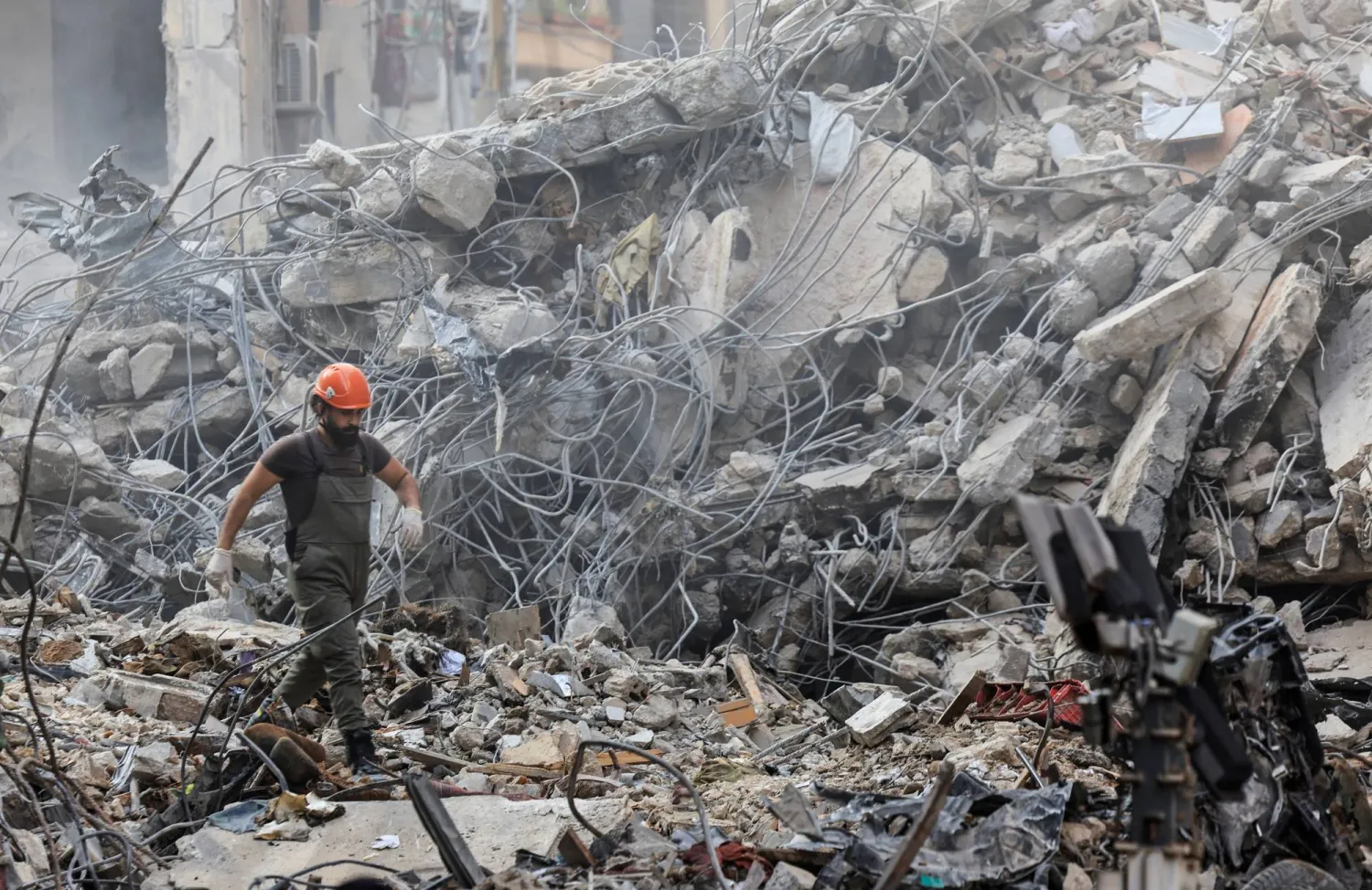 A civil defense member walks among the debris at the site of an Israeli strike in Beirut's Basta neighborhood, amid the ongoing hostilities between Hezbollah and Israeli forces, Lebanon November 23, 2024. REUTERS/Thaier Al-Sudani 