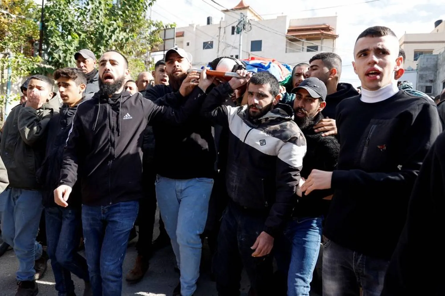  People attend the funeral of two Palestinians killed in an Israeli raid, in Yabad near Jenin in the Israeli-occupied West Bank, November 25, 2024. (Reuters)