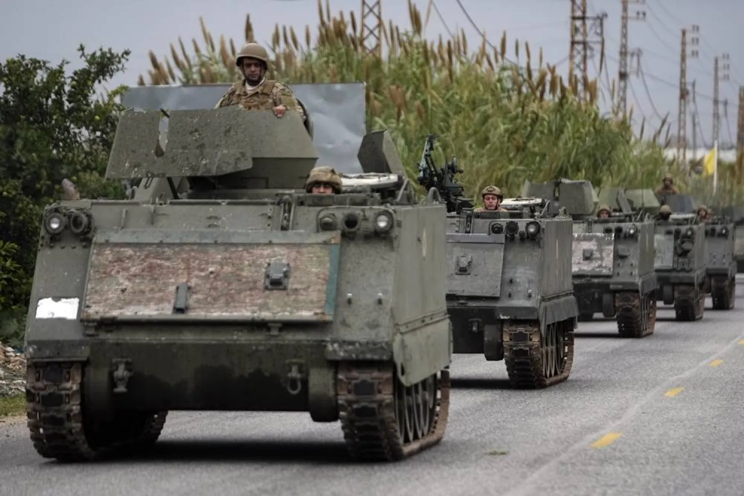  Lebanese soldiers ride in a convoy in Mansouri, as they head to southern Lebanon, following a ceasefire between Israel and Hezbollah that went into effect on Wednesday, Nov. 27, 2024. (AP)