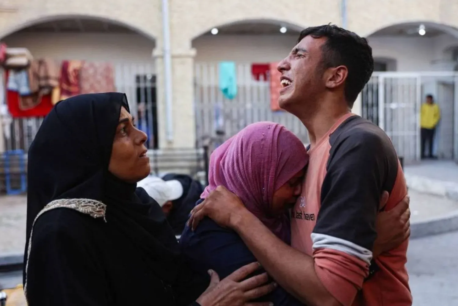 Relatives mourn the death of Atef Al-Atout, a Palestinian man who his family said was shot dead as he fled Beit Lahia in the northern Gaza Strip toward in Gaza City, in front of the al-Maamadani hospital on November 6, 2024. (AFP)
